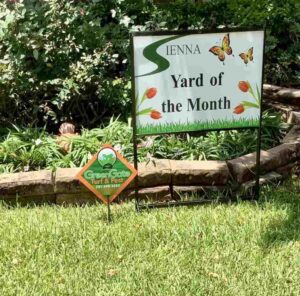 A Banner on the Home Lawn Area Highlighting Yard of the Month in Houston, TX