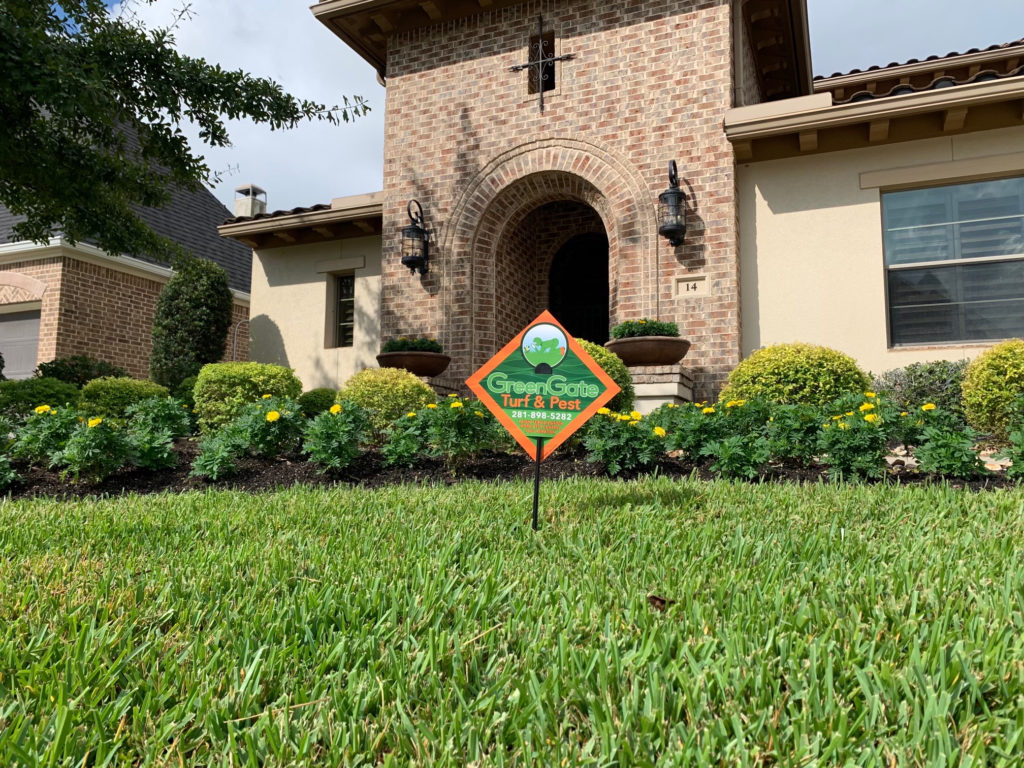 green grass lawn care sign