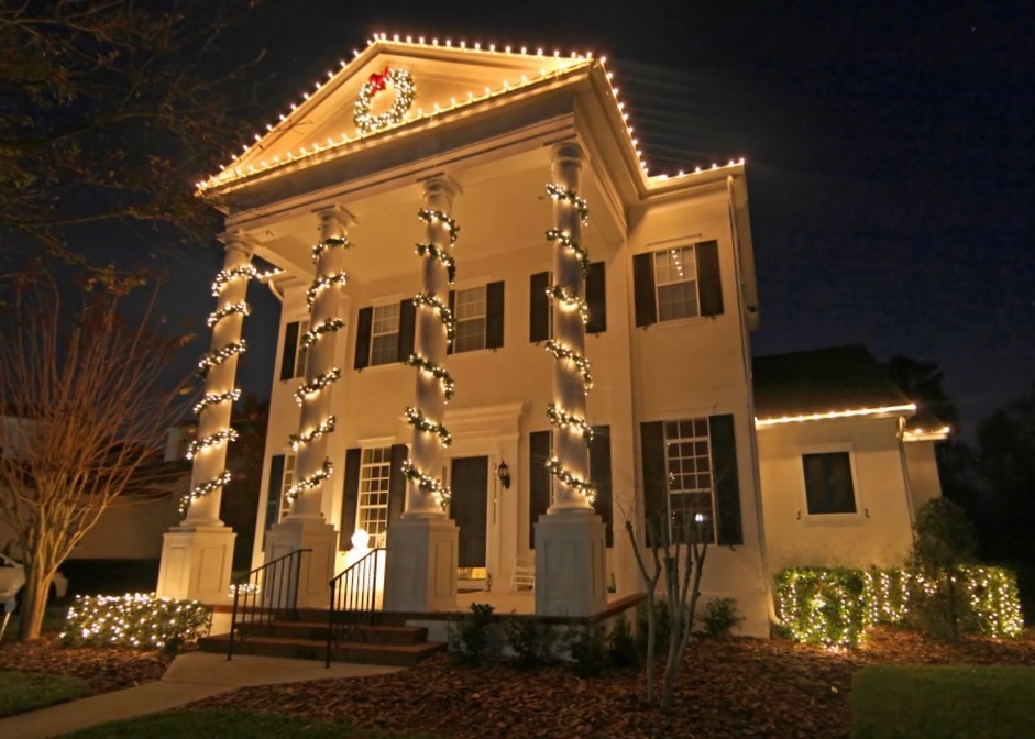 colonial house with lights on columns