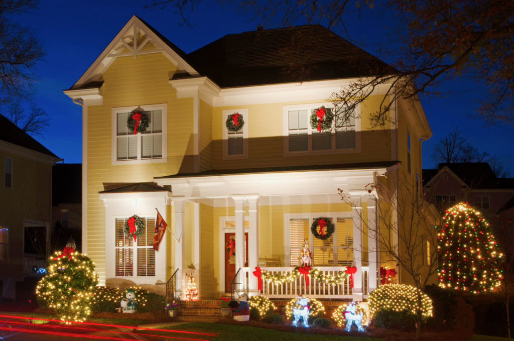 house with lights and wreaths