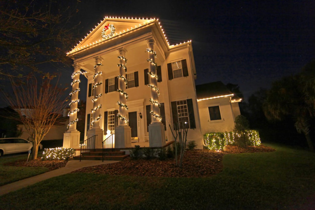 colonial house with lights