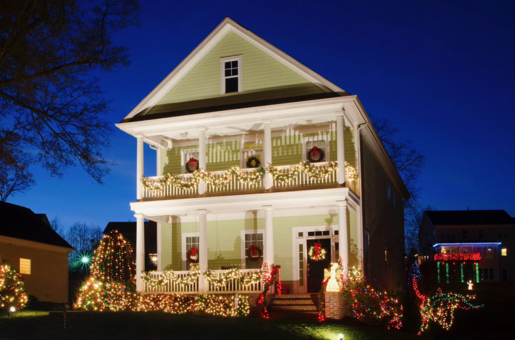 Colonial house with lights and wreaths