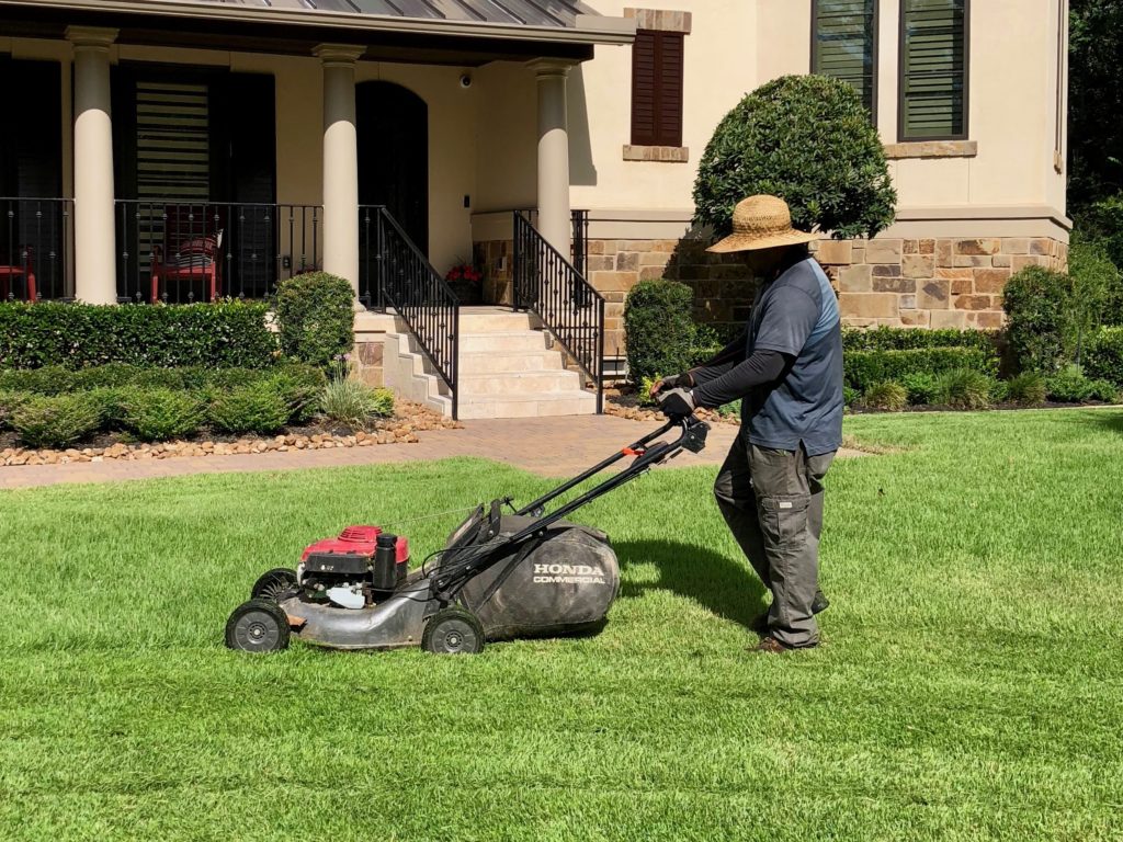 greengate employee mowing lawn in tomball, tx