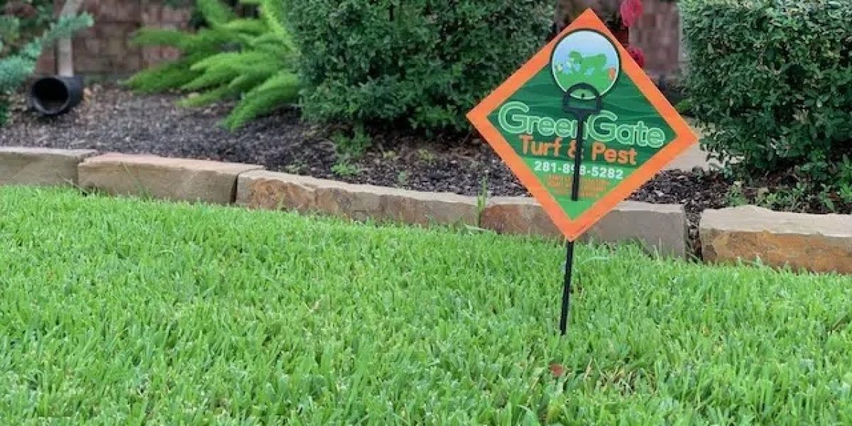 Close up shot of a greengate sign in a green lawn after a lawn fertilizer service; local lawn care services